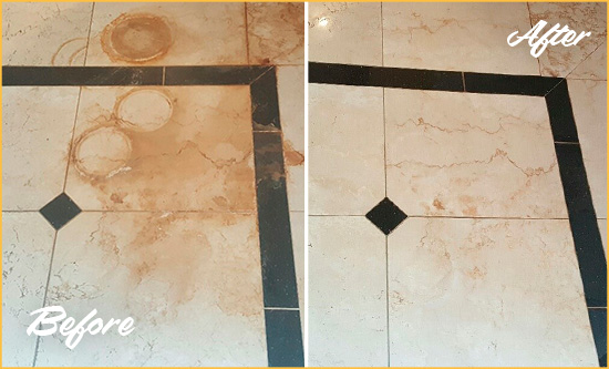 Before and After Picture of a Cheeks Hard Surface Restoration Service on a Marble Floor to Eliminate Rust Stains